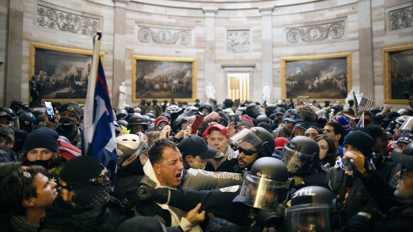 Police clash with supporters of US President Donald Trump who breached security and entered the Capitol building in Washington D.C., United States on January 06, 2021. Pro-Trump rioters stormed the US Capitol as lawmakers were set to sign off Wednesday on President-elect Joe Biden's electoral victory in what was supposed to be a routine process headed to Inauguration Day.