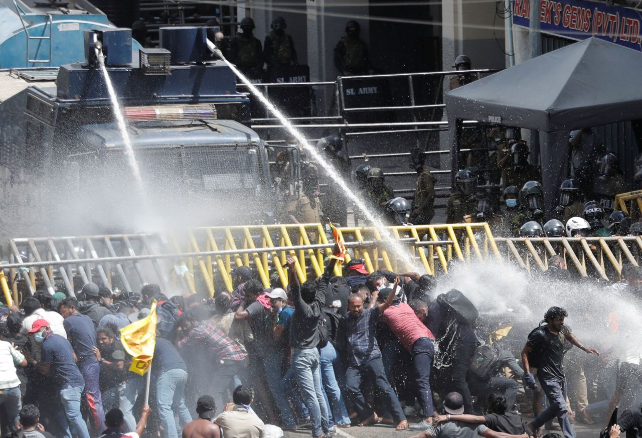 Police use a water cannon as they try to disperse protesters Saturday in Colombo.