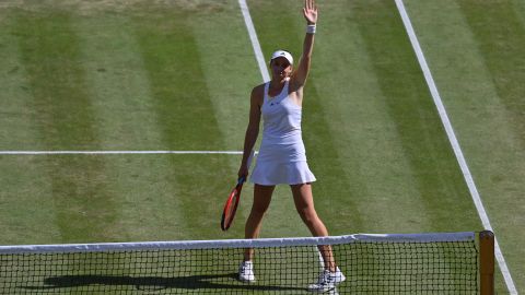 Rybakina celebrates beating Jabeur and winning the women's singles title at Wimbledon.