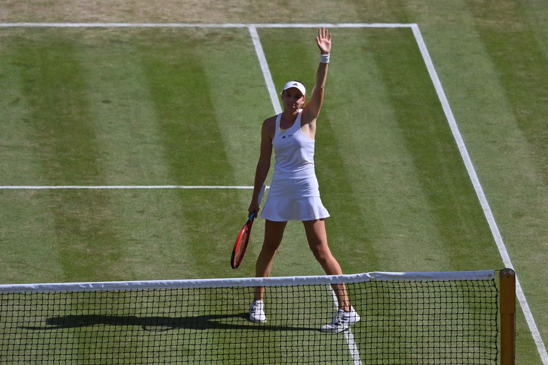 Rybakina celebrates beating Jabeur and winning the women's singles title at Wimbledon.