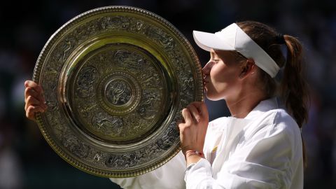 LONDON, ENGLAND - JULY 09: Elena Rybakina of Kazakhstan kisses the trophy after beating Ons Jabeur of Tunisia during Women's Singles Final on Day 13 of The Championships Wimbledon 2022 at The All England Lawn Tennis and Croquet Club on July 09 2022 London, UK.  (Photo by Clive Brunskill/Getty Images)