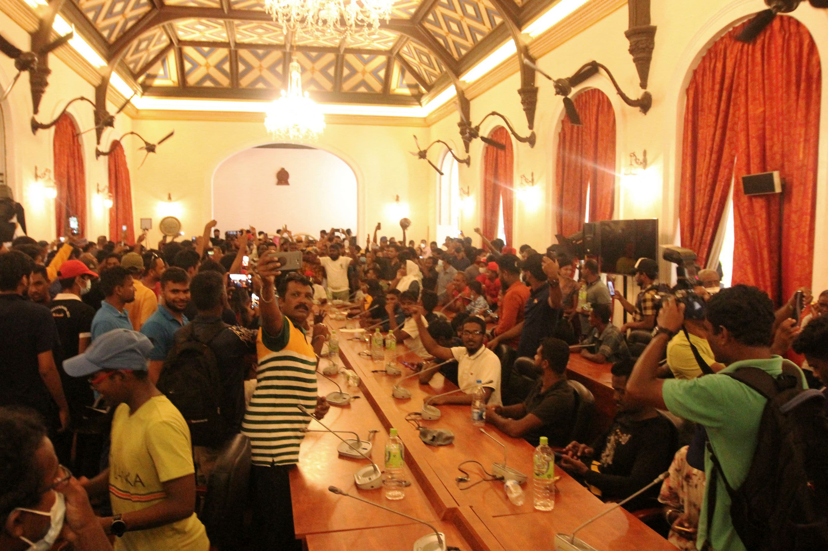 People gather inside the President's House.