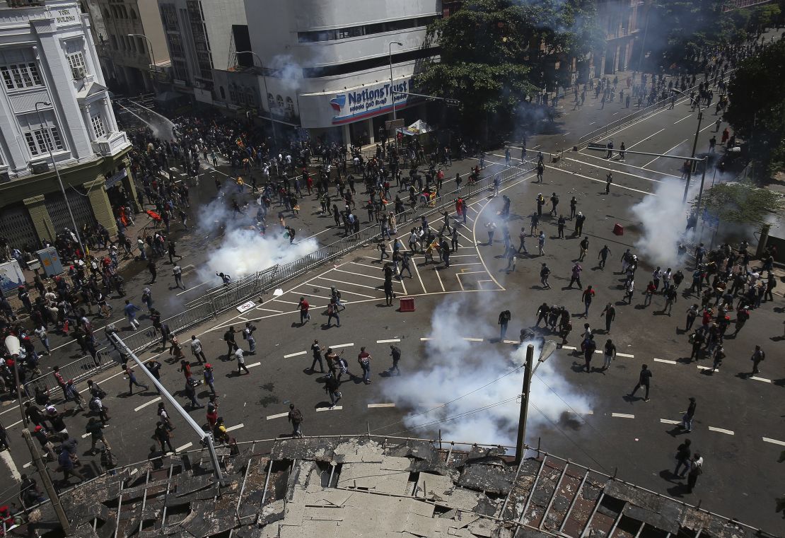 Police fire water and tear gas to disperse protesters gathering in a street leading to the President's official residence on July 9.