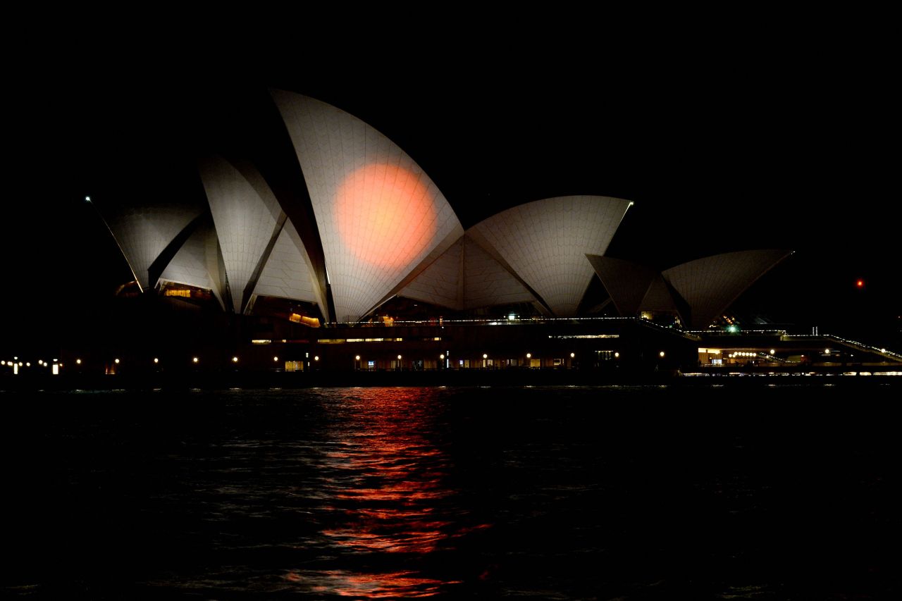 The Sydney Opera House is lit up in the colors of the Japanese flag on July 10 in honor of Abe in Sydney, Australia.