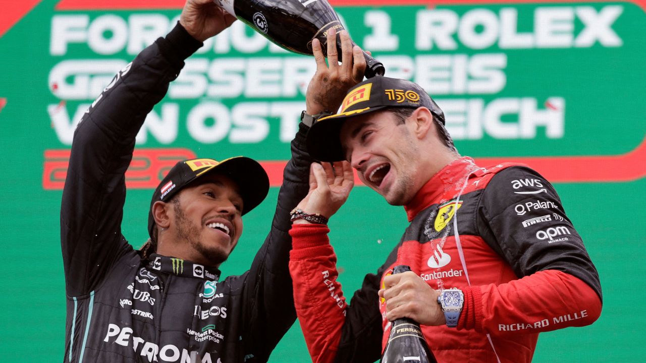 Leclerc celebrates with Lewis Hamilton on the podium after winning the Austrian Grand Prix.