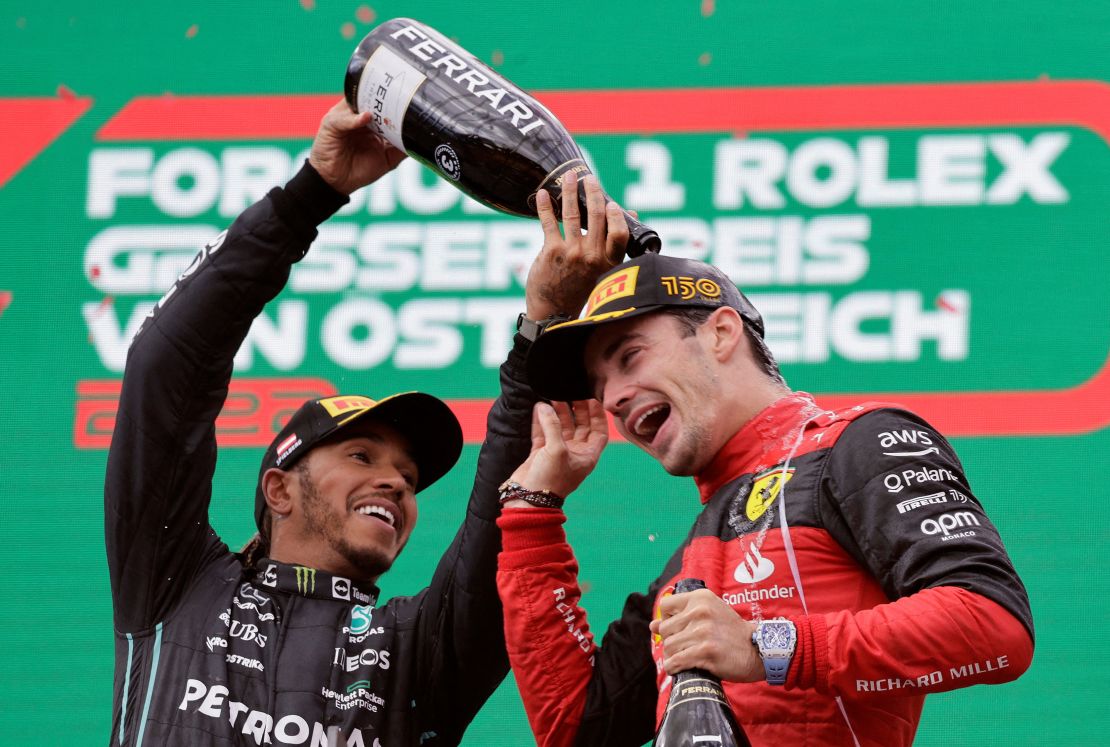 Leclerc celebrates with Lewis Hamilton on the podium after winning the Austrian Grand Prix.