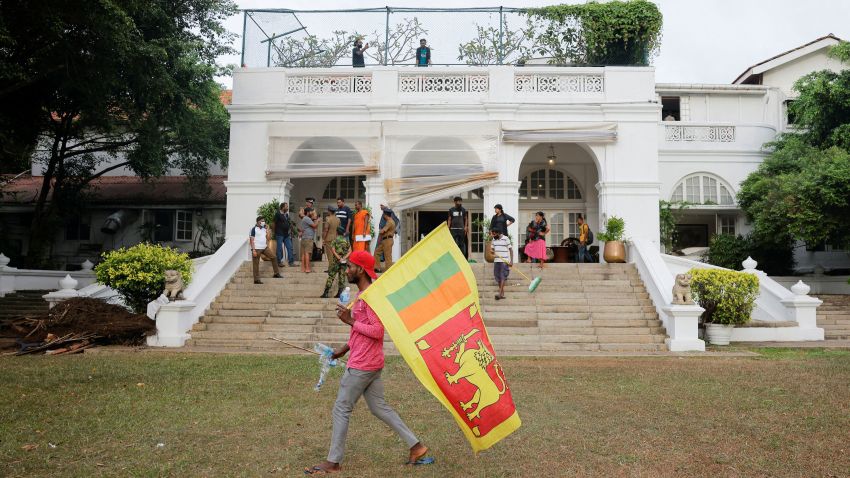 A demonstrator walks in the garden at the Prime Minister's residence on the following day after demonstrators entered the building, amid the country's economic crisis, in Colombo, Sri Lanka July 10, 2022. REUTERS/Dinuka Liyanawatte