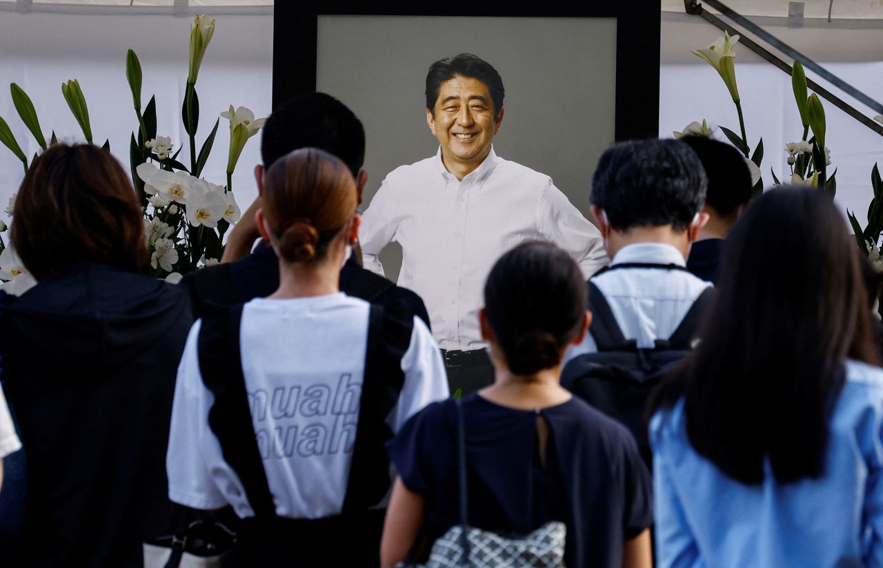 People lay flowers at Zojoji Temple, where the vigil and funeral of late former Japanese Prime Minister Shinzo Abe, will be held in Tokyo, Japan, on July 11.