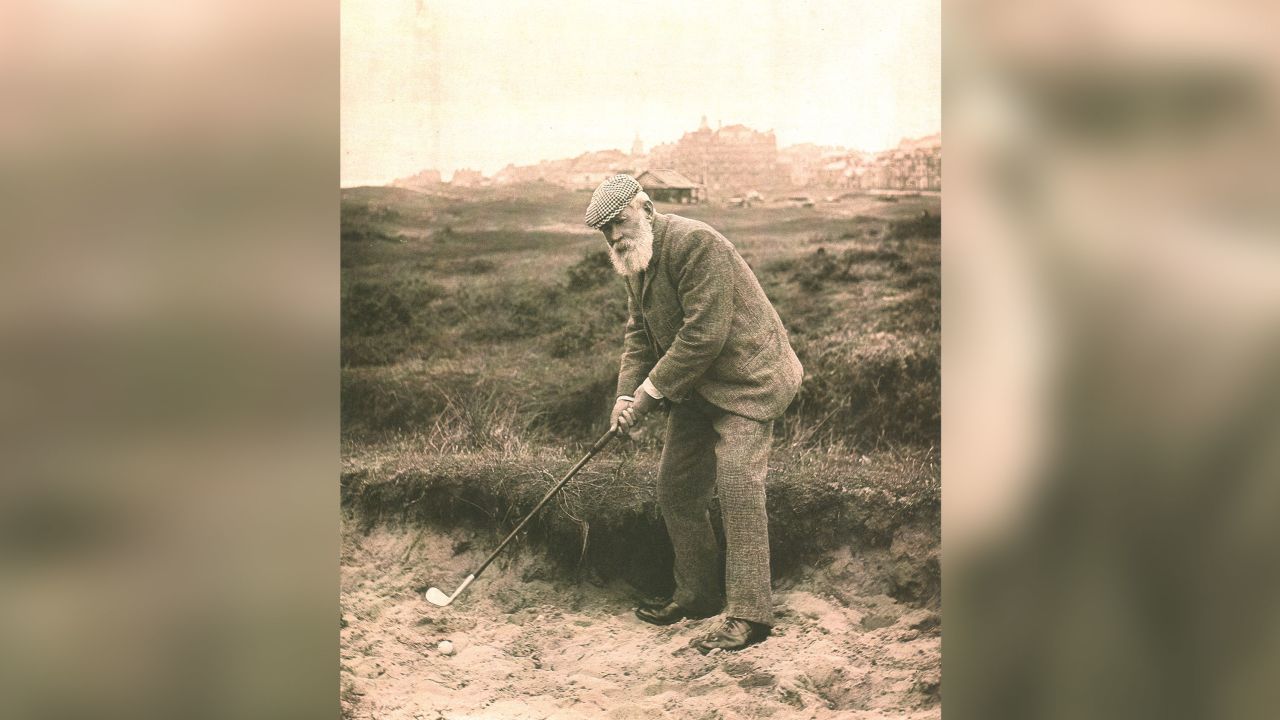 Old Tom Morris, one of golf's early leaders, is photographed preparing to hit a shot. 