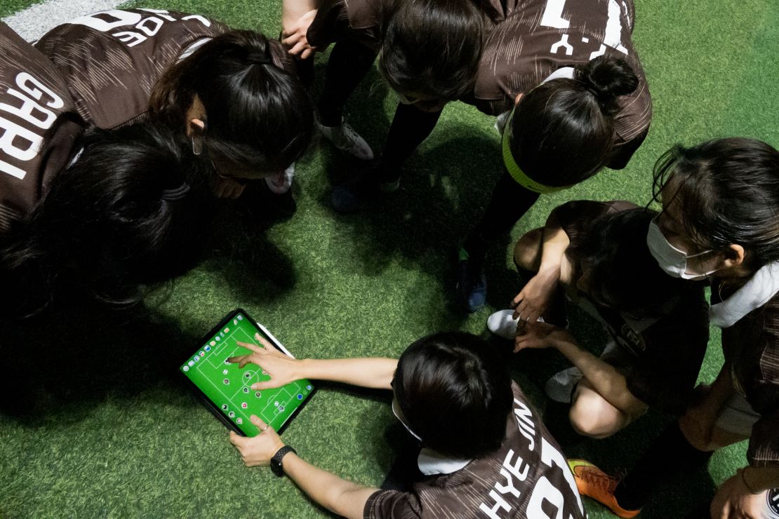 Nutty FC players strategizing at a training session.