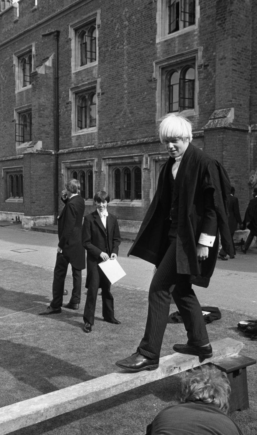 A 15-year-old Johnson, right, is seen outside Eton College, a boarding school outside London, in 1979.