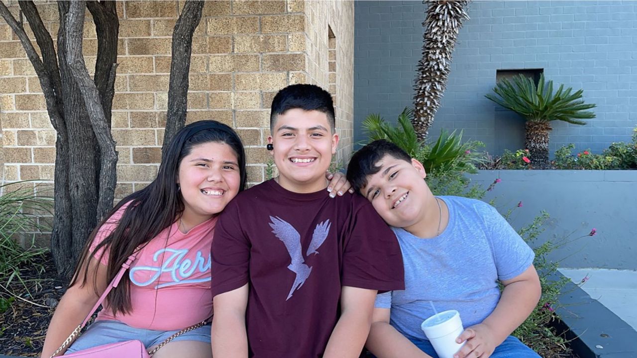AJ Martinez, right, with his brother and sister.