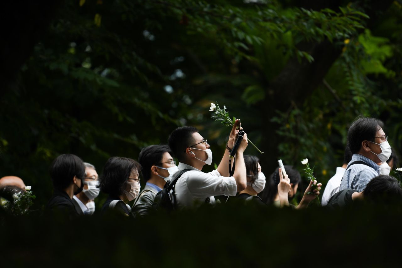 People pay their final respects to late former Prime Minister Shinzo Abe at the Zojoji temple in Tokyo, Japan, on Tuesday.