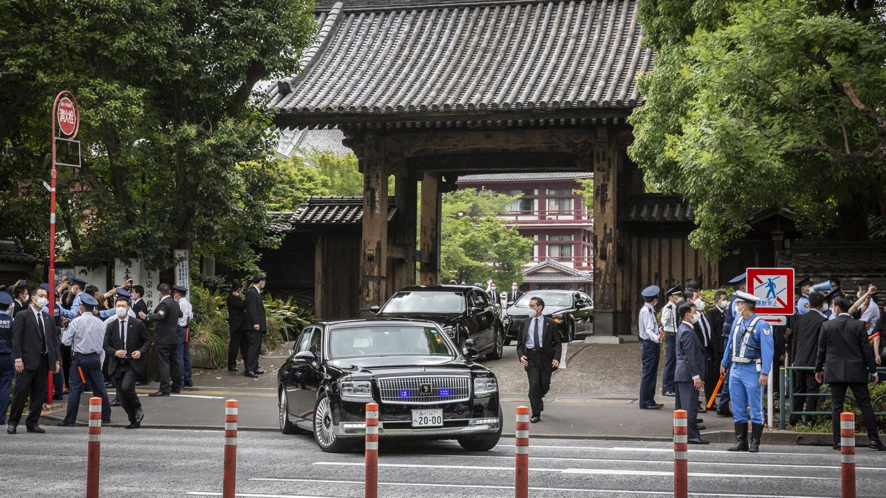 A car containing Japanese Prime Minister Fumio Kishida leaves the Zojoji Temple after the funeral for former Prime Minister Shinzo Abe on July 12.