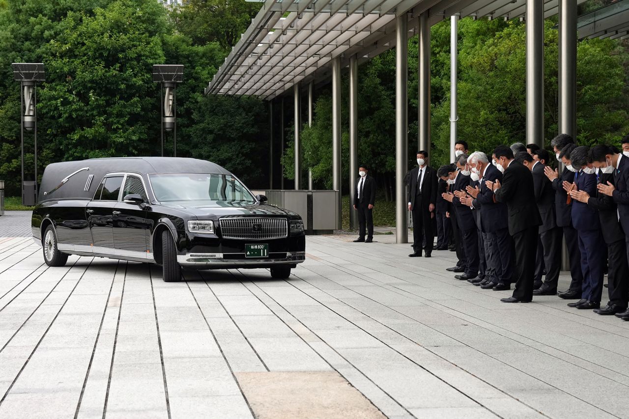 A hearse carrying the body of former Japanese Prime Minister Shinzo Abe makes a brief visit to the Prime Minister's Office as Japan's Prime Minister Fumio Kishida, officials and employees offer prayers, in Tokyo, Japan, on July 12.
