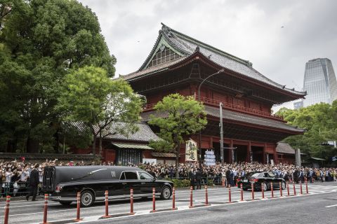 A car carrying the body of former Japanese Prime Minister Shinzo Abe leaves Zojoji temple following his funeral on July 12, in Tokyo, Japan. 