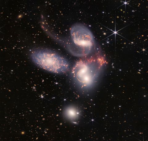 The five galaxies of Stephan's Quintet can be seen here in a new light. The galaxies appear to dance with one another, showcasing how these interactions can drive galactic evolution.