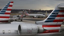 A jet from American Eagle, a regional branch of American Airlines (AA), taxis past other AA aircraft at Ronald Reagan Washington National Airport in Arlington, Virginia, U.S. December 3, 2021. 