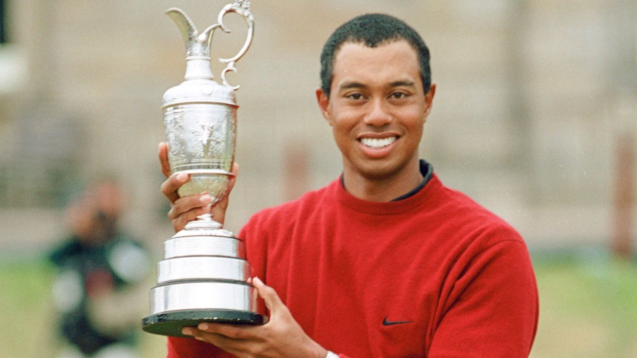 Woods holding the Claret Jug after his victory in the 2000 Open.