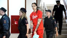 WNBA star and two-time Olympic gold medalist Brittney Griner is escorted to a courtroom for a hearing, in Khimki just outside Moscow, Russia, Thursday, July 7, 2022. Jailed American basketball star Brittney Griner returns to a Russian court on Thursday amid a growing chorus of calls for Washington to do more to secure her release nearly five months after being arrested on drug charges. (AP Photo/Alexander Zemlianichenko)