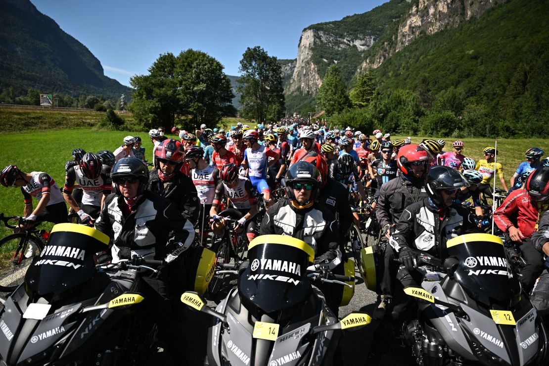 The peloton was forced to stop due to protest action on the race route.