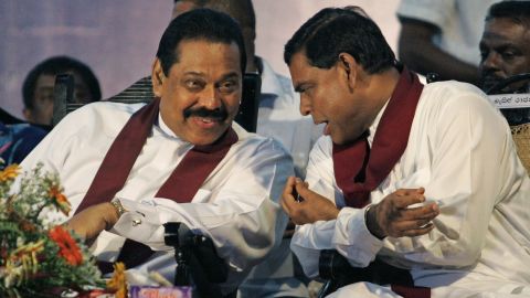 Former Sri Lankan President Mahinda Rajapaksa, left, and his brother Basil Rajapaksa, right, during a campaign in the suburb of Kirillawala, Sri Lanka, on April 4, 2010.