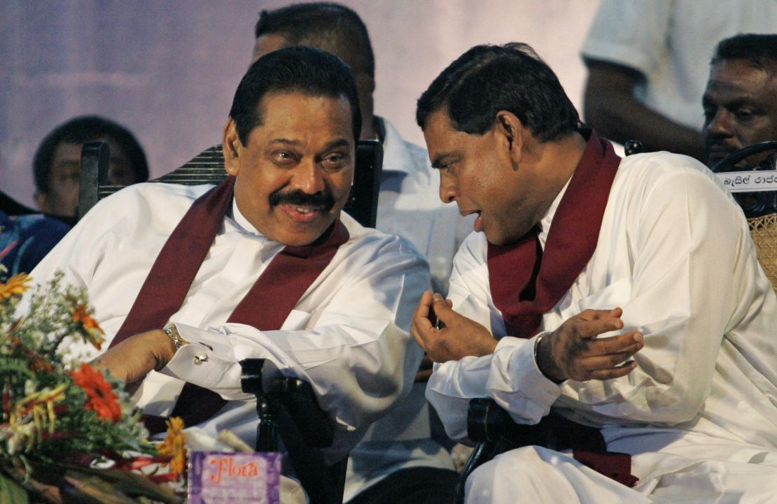 Former Sri Lankan President Mahinda Rajapaksa, left, and his brother Basil Rajapaksa, right, during a campaign in the suburb of Kirillawala, Sri Lanka, on April 4, 2010.