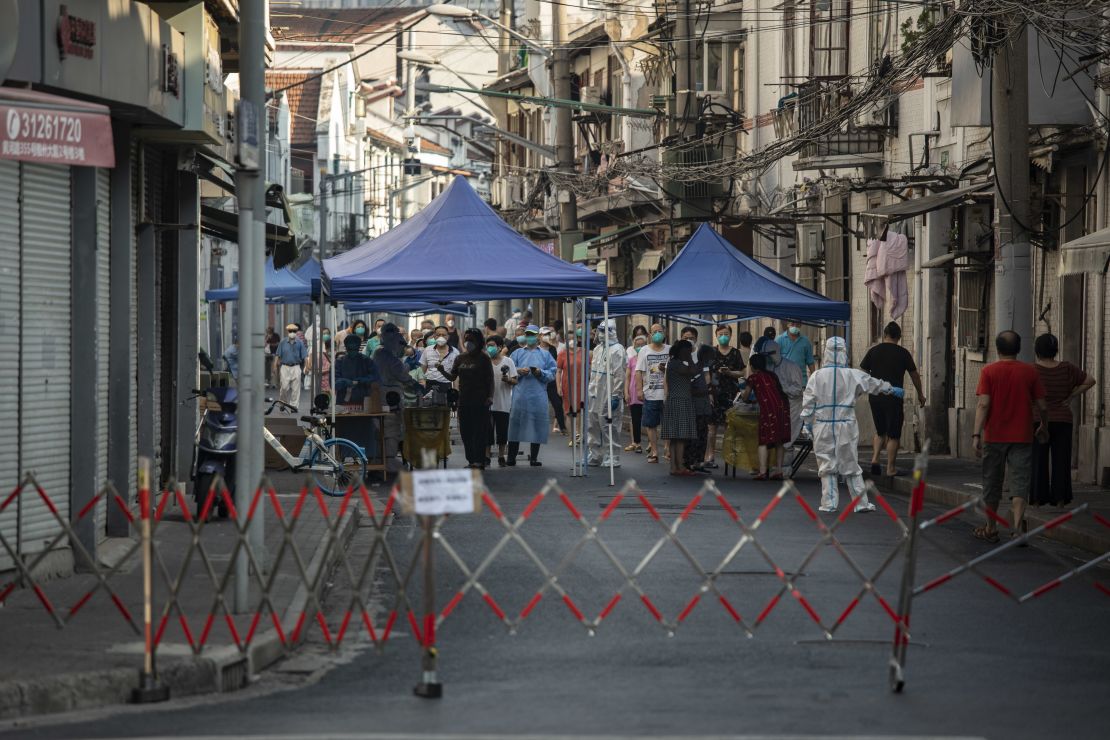 Shanghai residents line up for Covid tests in a locked down neighborhood on July 10.