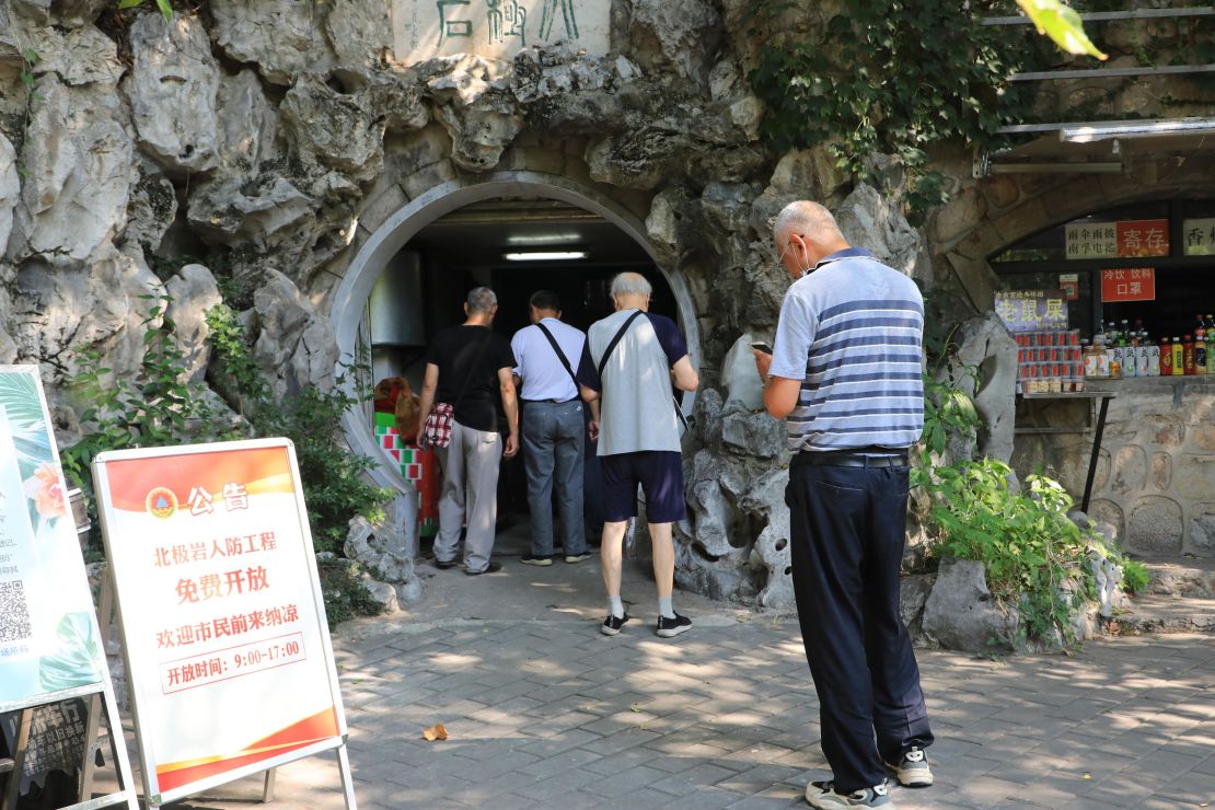 Residents in Nanjing, China, enter an air raid shelter to escape the heat on July 10.