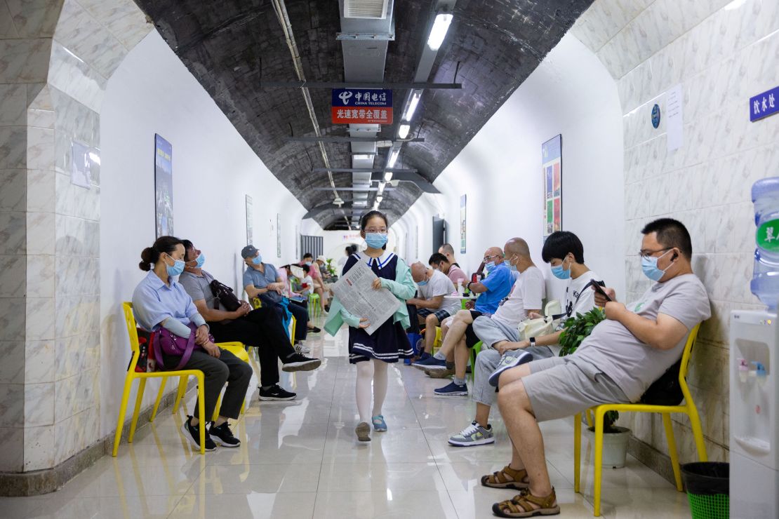 Residents spend their time in an air-raid shelter to escape summer heat amid a heat wave warning in Nanjing, Jiangsu province on July 12.