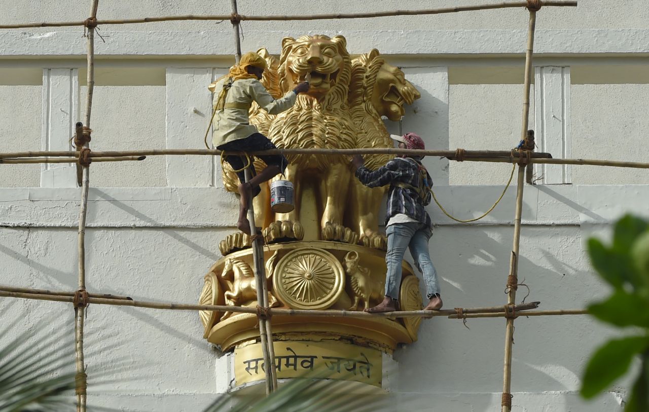 Critics have suggested that other depictions of the national emblem, such as this one in Mumbai, have a more benevolent appearance. 