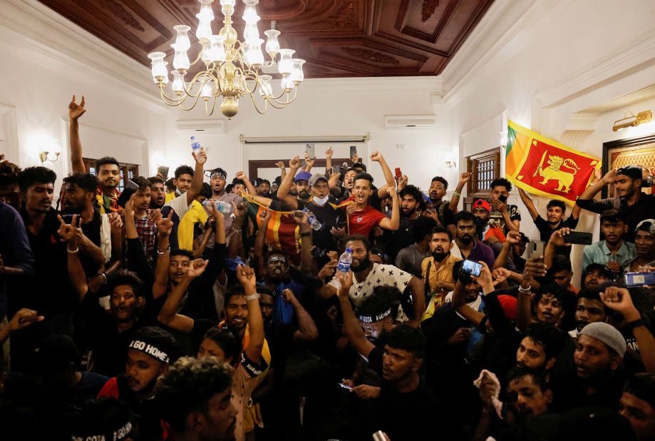 Protesters celebrate after they entered the prime minister's office on Wednesday.