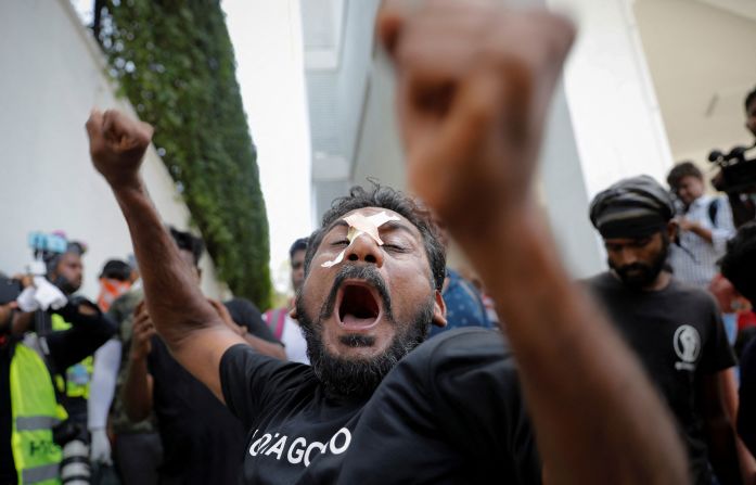 Protesters shout slogans outside the prime minister's office.