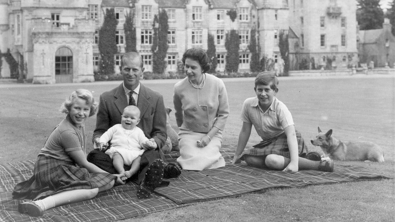 Queen Elizabeth II and Prince Philip picnic with three of their children outside Balmoral in 1960.