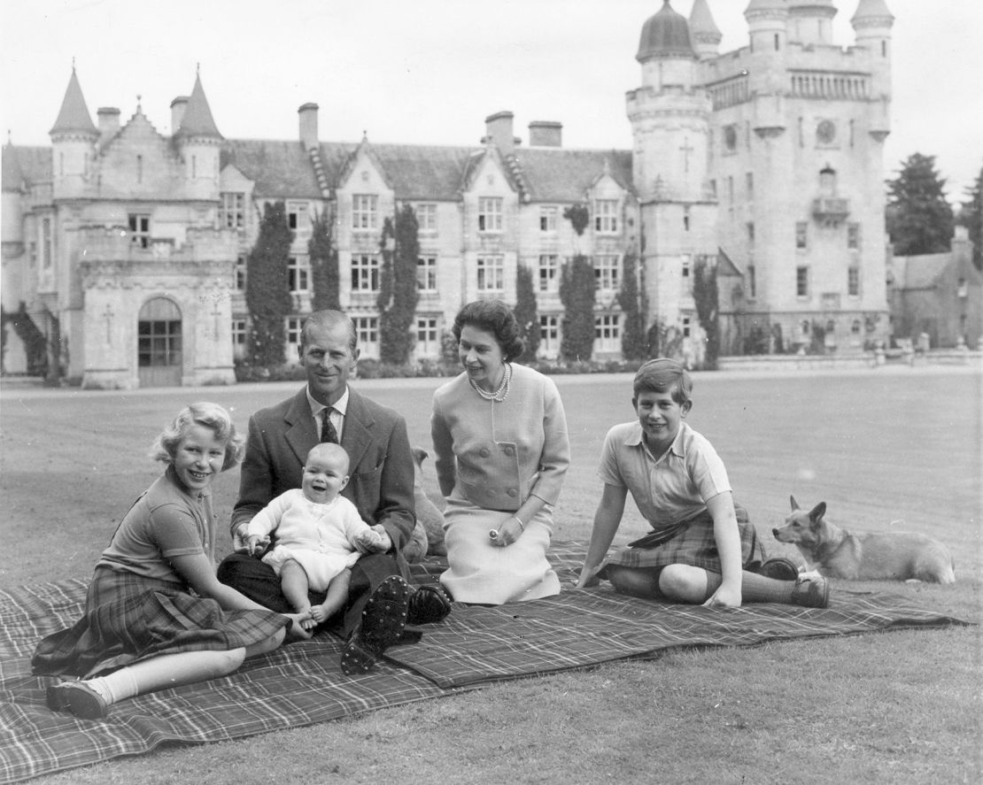 Queen Elizabeth II and Prince Philip picnic with three of their children outside Balmoral in 1960.