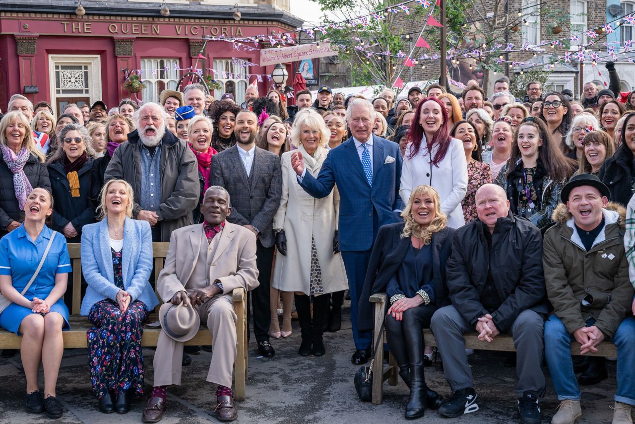 Charles and Camilla pose for a group photo as they visit the set of "EastEnders" in March 2022.