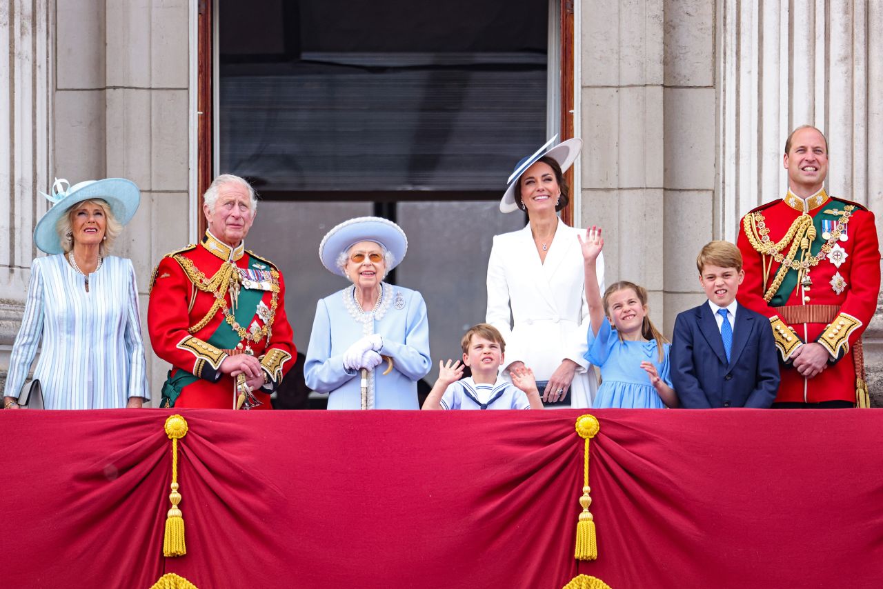 Members of the royal family watch jets roar over Buckingham Palace during the Trooping the Colour parade in London in June 2022. From left are Camilla, Charles, Queen Elizabeth II, Prince Louis, Duchess Catherine, Princess Charlotte, Prince George and Prince William.