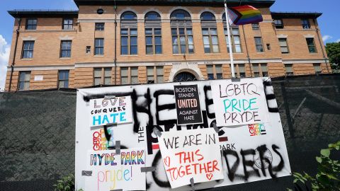Signs that show support for the LGBTQ community are taped over threatening graffiti, Monday, July 11, 2022, at the site of the Pryde Senior Housing development for LGBTQ+ residents in Boston.