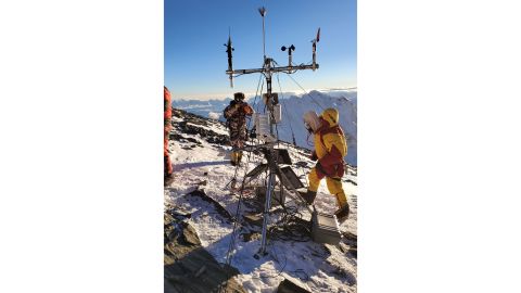 The team doing maintenance on the weather station located at South Col. 