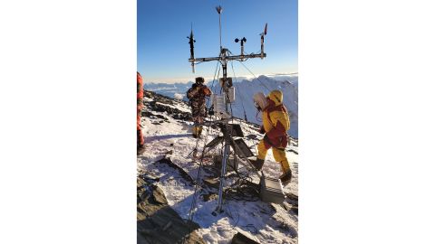 The team doing maintenance on the weather station located at South Col.
