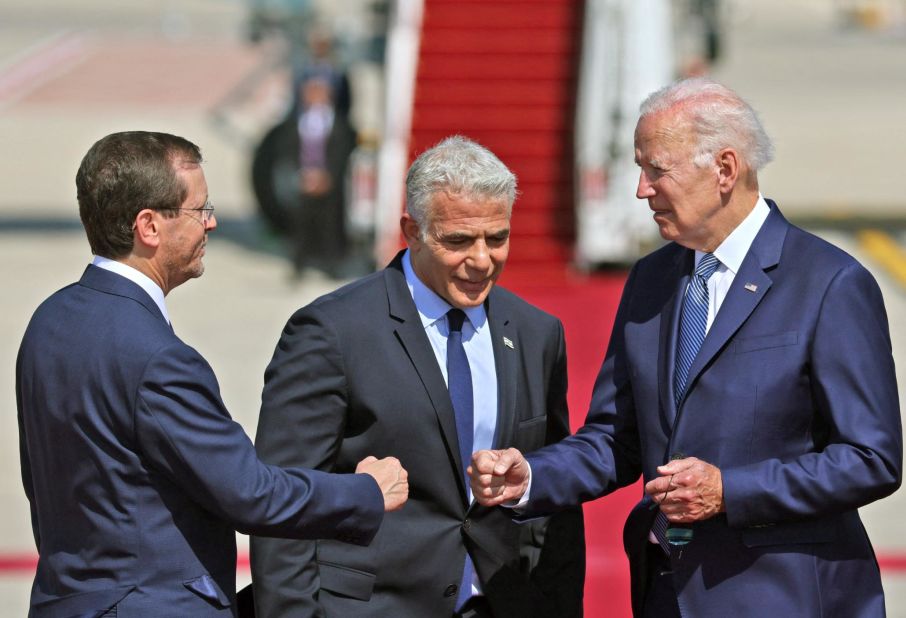 After Air Force One arrived in Israel, Biden was greeted by Lapid and Herzog. The White House said the fist bumps are <a href="https://www.cnn.com/2022/07/13/politics/handshakes-joe-biden-israel/index.html" target="_blank">part of an effort to reduce physical contact</a> amid the rapid spread of a new coronavirus variant. But Biden was later seen shaking hands as well.