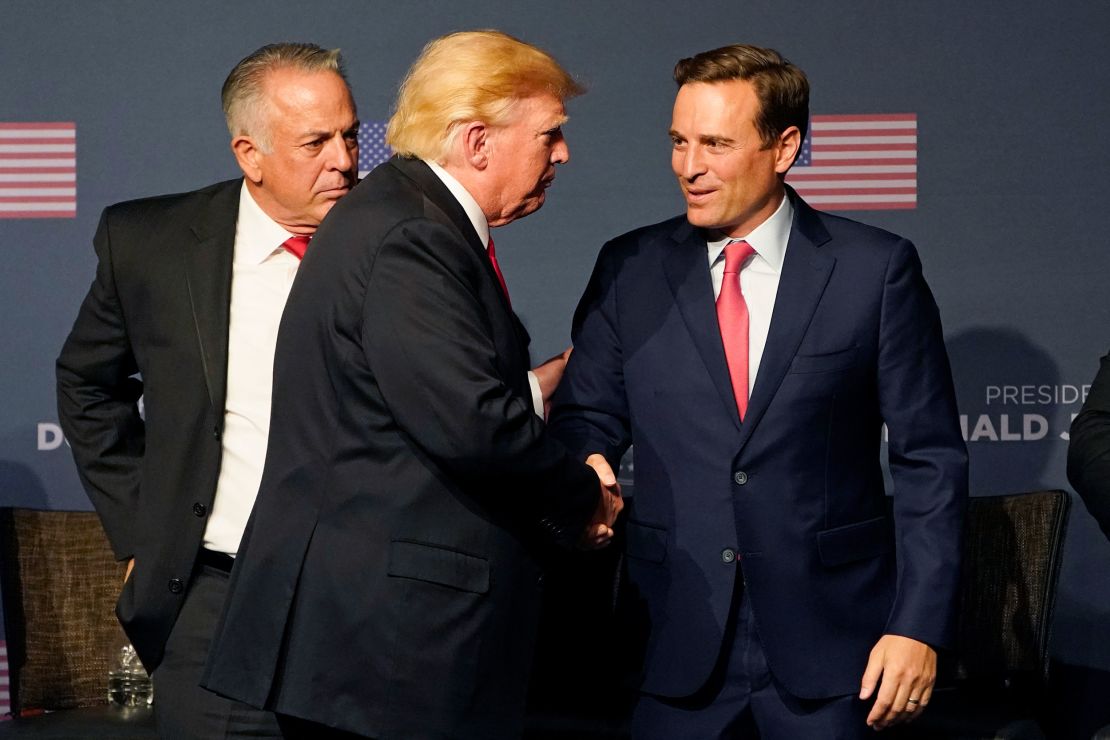 Former President Donald Trump, center, shakes hands with Nevada GOP Senate nominee Adam Laxalt, right, and Clark County Sheriff Joe Lombardo, the GOP nominee for governor, during an event in Las Vegas last Friday.