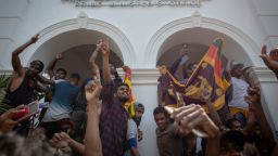 COLOMBO, SRI LANKA - JULY 13: Protestors chant slogans as they celebrate after taking control of the Prime Ministers office during a protest seeking the ouster of Sri Lanka's Prime Minister Ranil Wickremesinghe amidst the ongoing economic crisis on July 13, 2022 in Colombo, Sri Lanka. President Gotabaya Rajapaksa has fled the country to Male while the Prime Minister Ranil Wickremesinghe has been appointed acting president, according to the parliament's speaker. (Photo by Abhishek Chinnappa/Getty Images)
