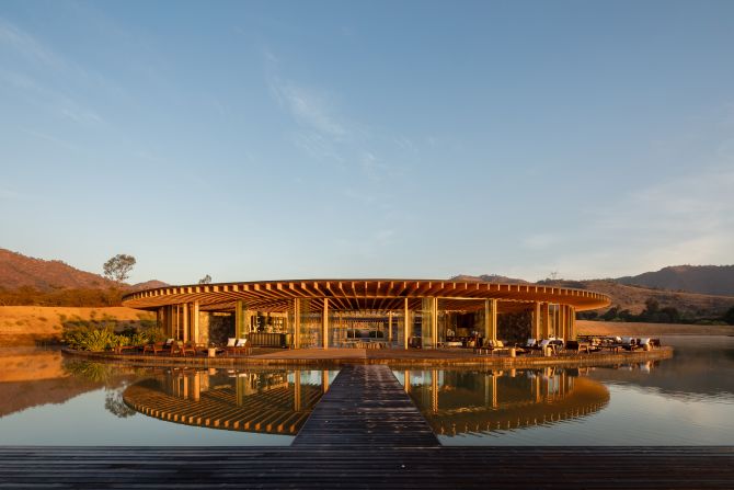 Designed by architecture firm Sordo Madaleno Arquitectos, the low-rise Valle San Nicolás clubhouse was intended to integrate with the surrounding landscape. The circular structure was built on a lake on the outskirts of Valle de Bravo, Mexico, with stone walls and wooden frames adding to its organic character.