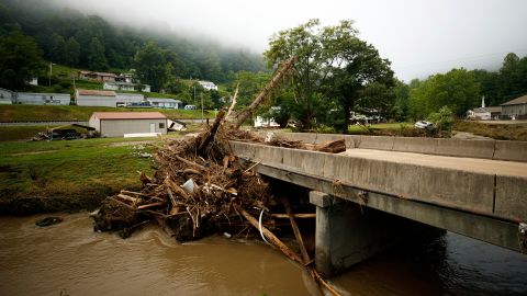 Debris builds up against a bridge, Thursday, July 14, 2022, in Whitewood, Virginia, following a flash flood.
