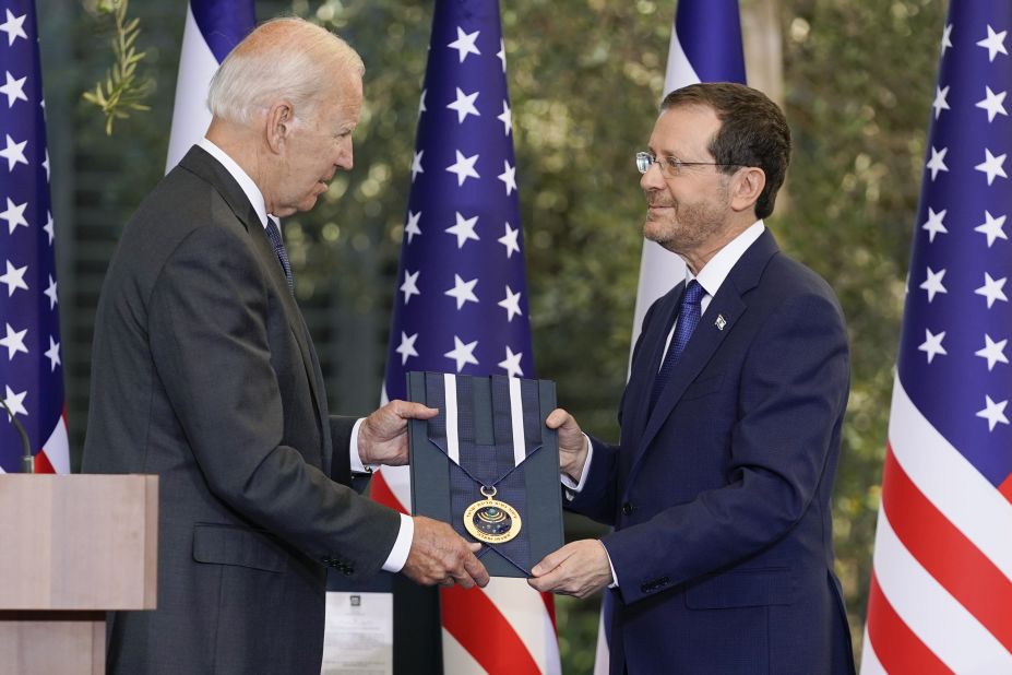 Israeli President Isaac Herzog awards Biden with the Israeli Presidential Medal of Honor on Thursday. Biden, who was recognized for his longtime support of Israel, said it was "among the greatest honors of my career."