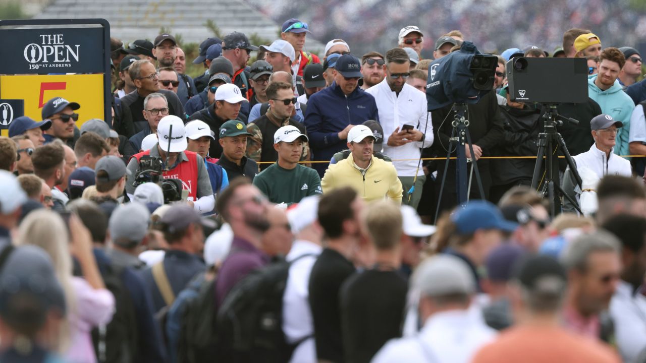 McIlroy and Morikawa look along the 5th fairway during the first round.