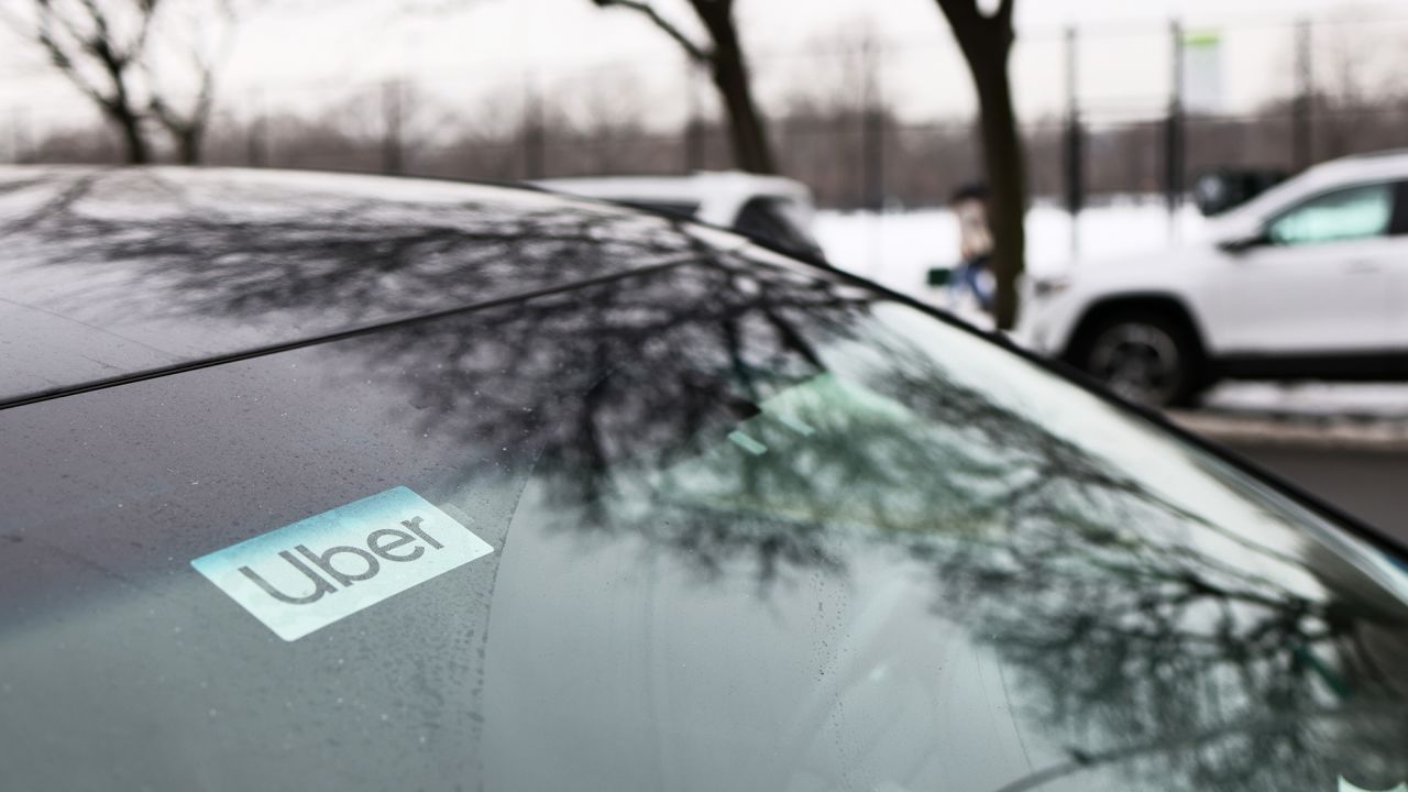 An Uber sticker is seen on a parked car in New York City in February 2021.