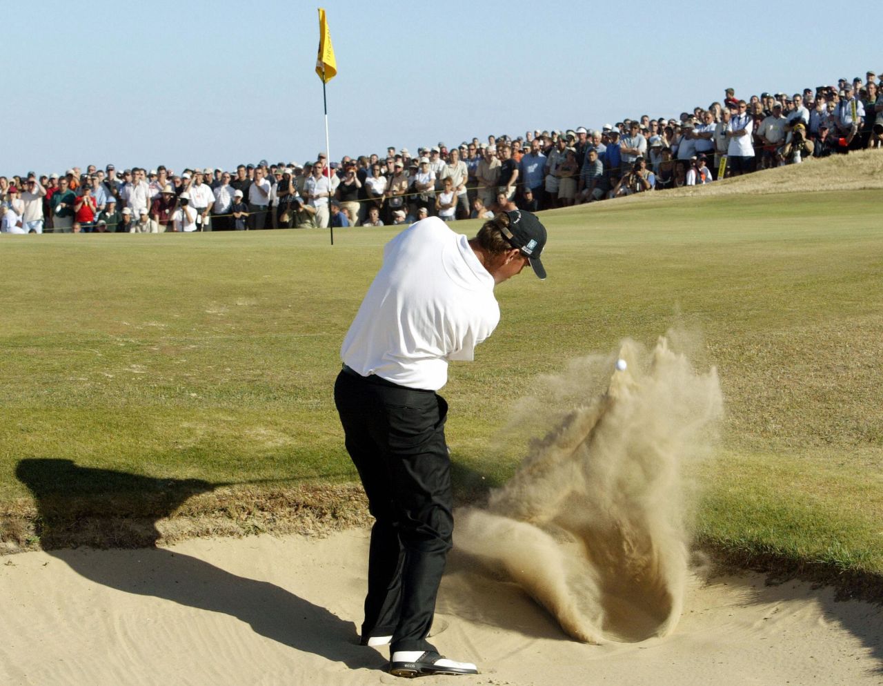 <strong>Thomas Bjorn digs his way out of a hole, 2003 -- </strong>Leading by two strokes with three holes to play <a href="https://www.theopen.com/latest/thomas-bjorn-iconic-open-moments" target="_blank" target="_blank">at Royal St George's in 2003</a>, Thomas Bjorn had one hand on the Claret Jug. Then he took a trip to the beach -- more specifically, a bunker on the par-three 16th. It took the Dane three shots to escape the sand trap and he carded a double bogey. Another dropped shot on the 17th and the dream was over. <br />