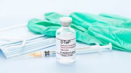 DTaP vaccine vial with gloves, mask, syringe. (Photo by: SCIENCE PHOTO LIBRARY via AP Images) 